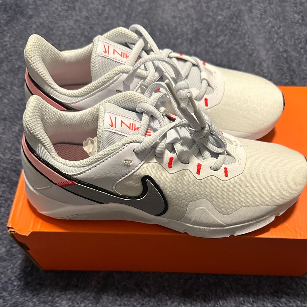 Nike Women’s White and Black Sneakers with Pink and silver Accents